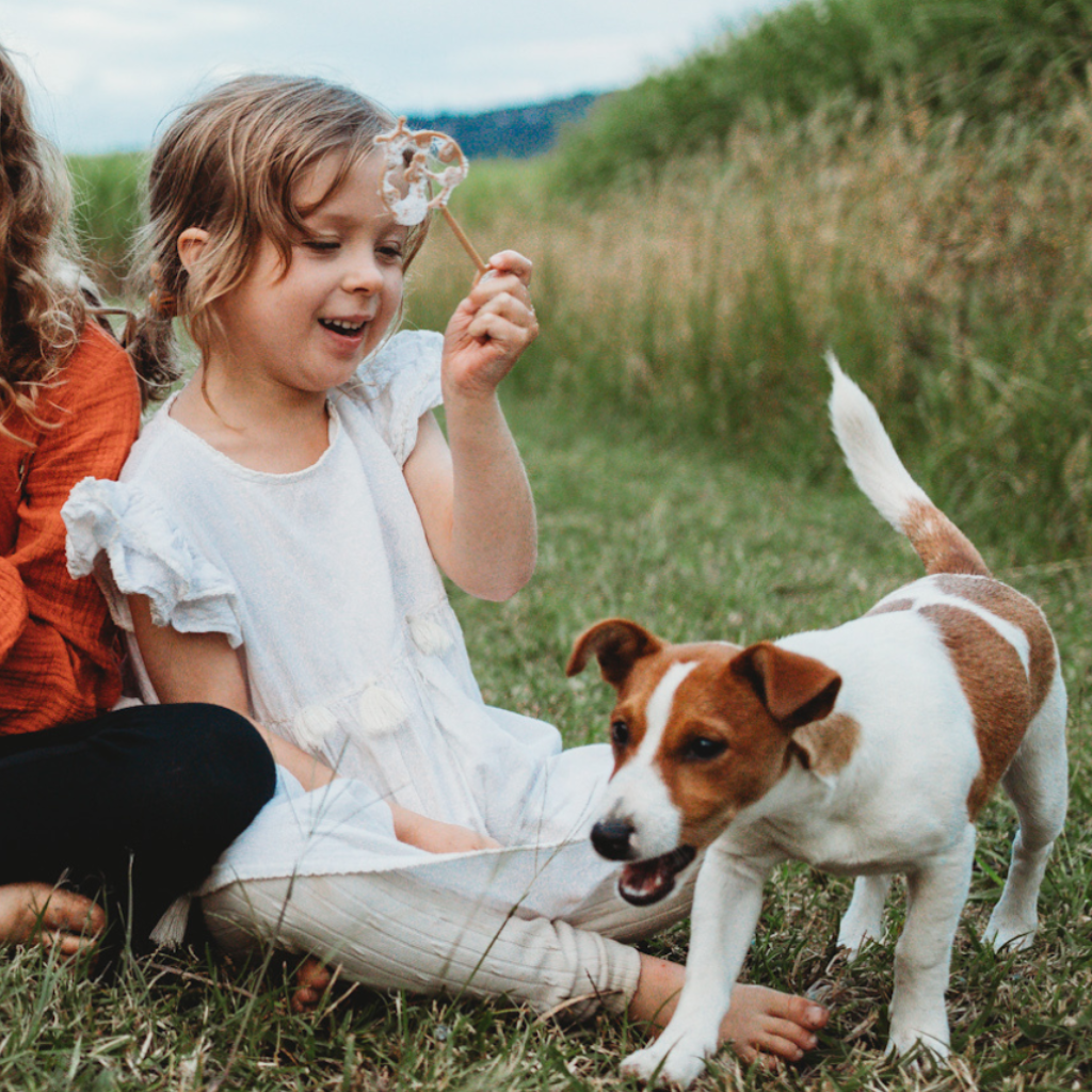 Young child with ladybird shaped bubble wand blowing bubbles. Australian made, all natural bubble wand which is biodegradable. Spark your child’s imagination with nature toys from Kinfolk Pantry.