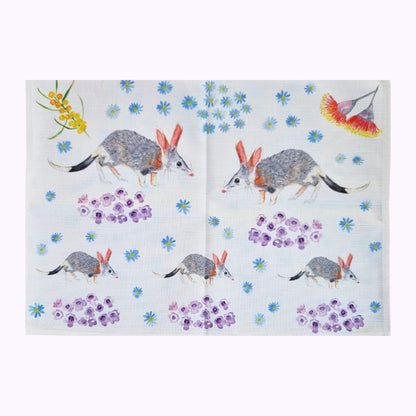 Folded Bilby tea towel. Exclusive Twizzle Designs cotton and linen tea towels make the best gift for any occasions. Supports bilby conservation.