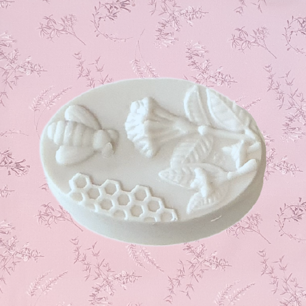 Honey 1 bee and honeycomb design soap are a great gift for her. A beautiful small gift for any occasion. Soft honey scented soap in a creamy colour. These bee and flower, honey bee soaps are exclusive to Twizzle Designs.