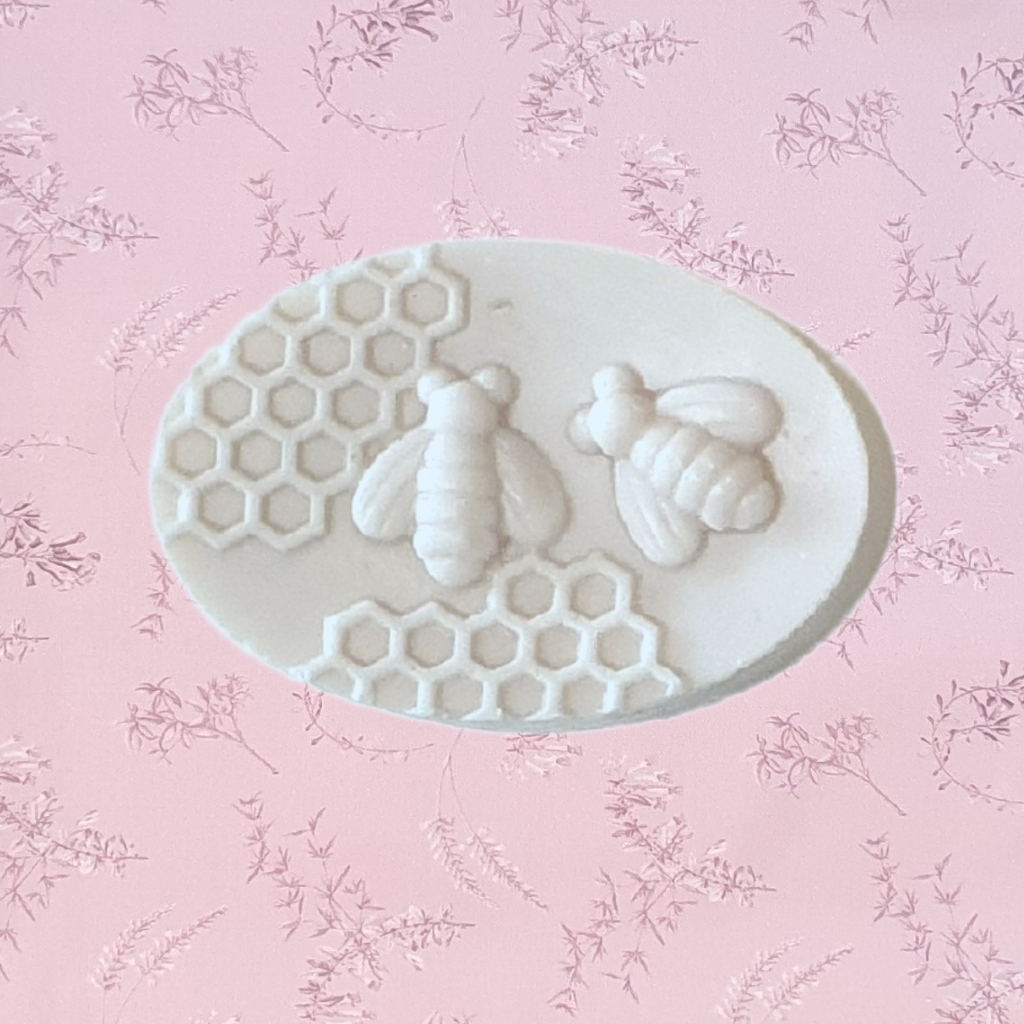 Honey bee soaps are a great gift for her. A beautiful small gift for any occasion. Soft honey scented soap in a creamy colour. These honey bee soaps with the 2 bees and honeycomb design are exclusive to Twizzle Designs.